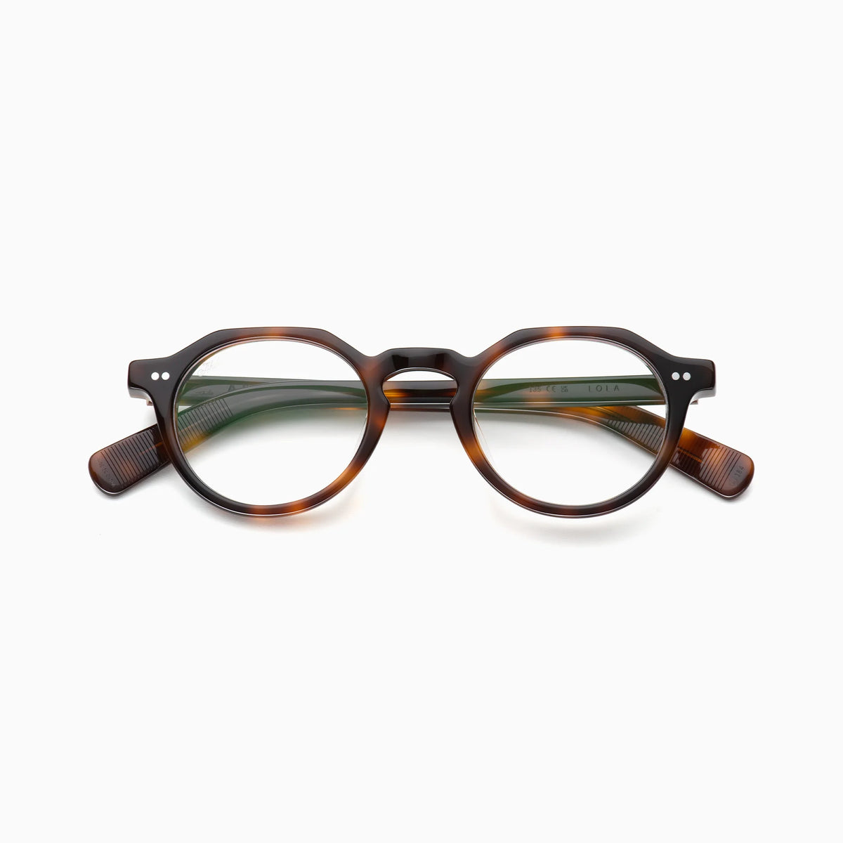 Akila Lola by Akila features round tortoiseshell optical frames with a keyhole bridge and dark brown accents. Set against a plain white background, these contemporary eyeglasses seamlessly blend classic style with modern sophistication.