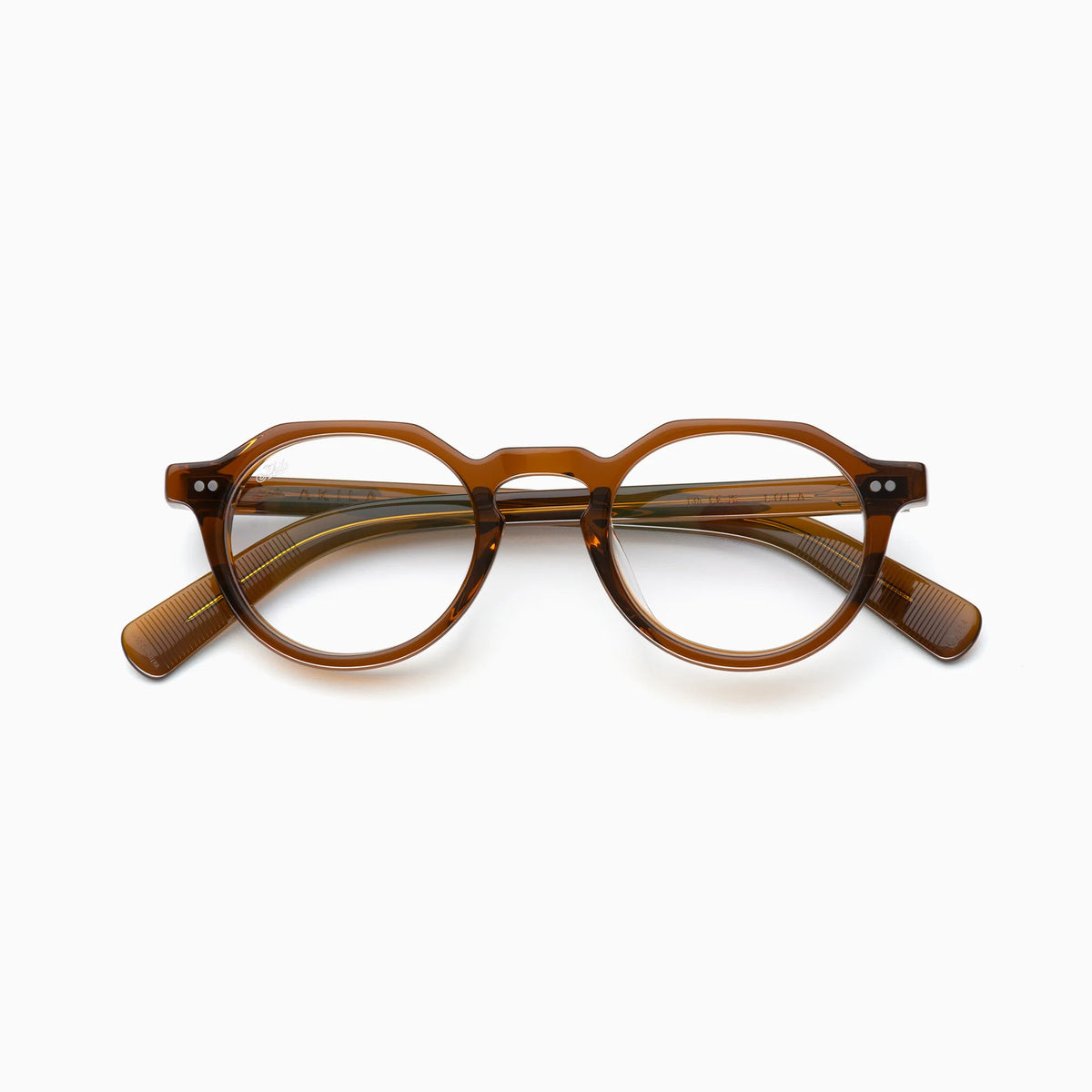 The Akila Lola by Akila features brown, round optical frames with thick rims and gently curved arms, displayed on a plain white background for a stylish take on contemporary eyeglasses.