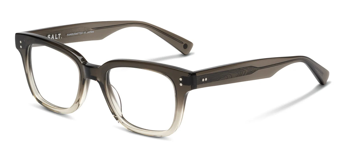 A pair of SALT. Max rectangular eyeglasses by SALT., featuring translucent brown thick frames with a subtle gradient, handcrafted in Japan and displayed on a white background.