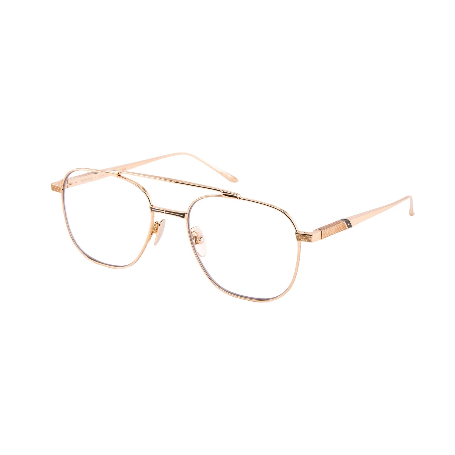 Introducing the Leisure Society Montez by Leisure Society—luxury rectangular eyeglasses with a thin gold metal frame and clear lenses. Expertly handmade in Japan, these elegant frames showcase gold temples adorned with subtle textured detailing near the hinges for a refined touch.