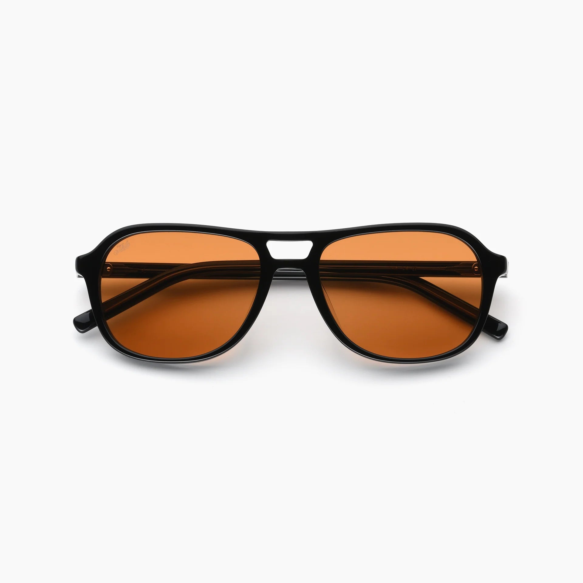A pair of aviator-style sunglasses with a thick black frame and warm orange-brown tinted lenses, shown against a plain white background.