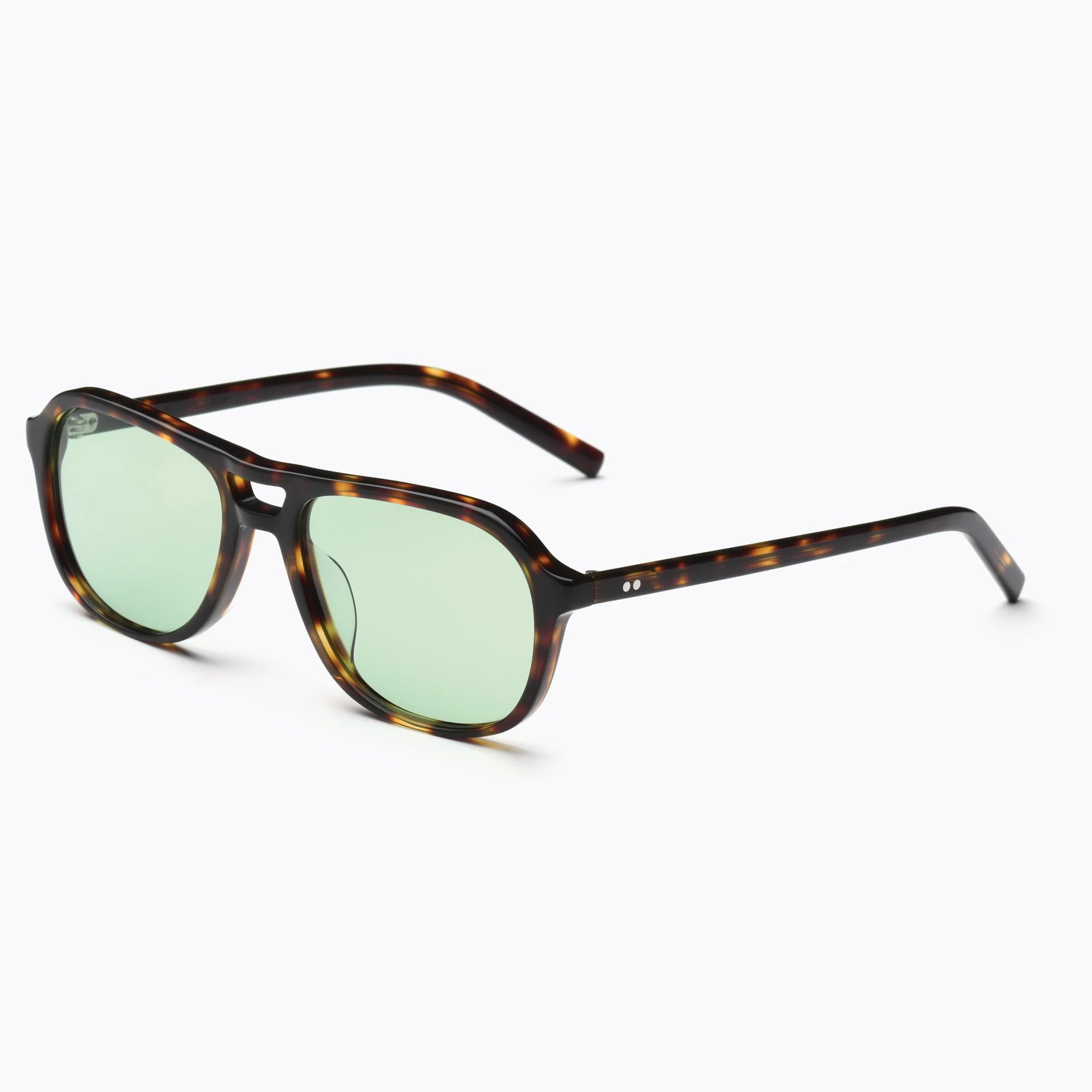 Sunglasses with tortoiseshell frame and green lenses on a white background