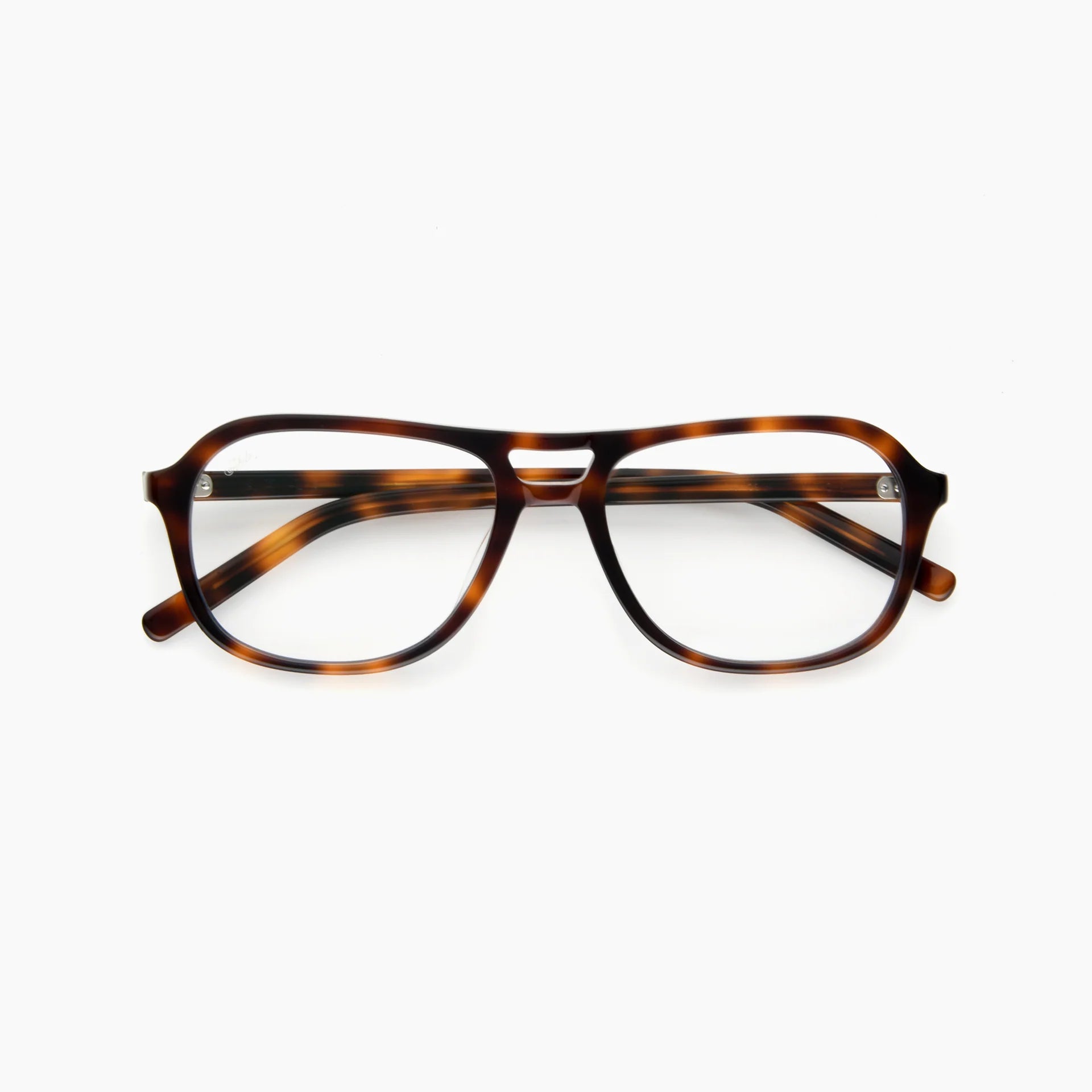 The Akila Myca by Akila is a pair of tortoiseshell eyeglasses with clear, blue-light-filtering lenses, featuring a prominent brow bar and rounded rectangular frames, displayed on a white background.