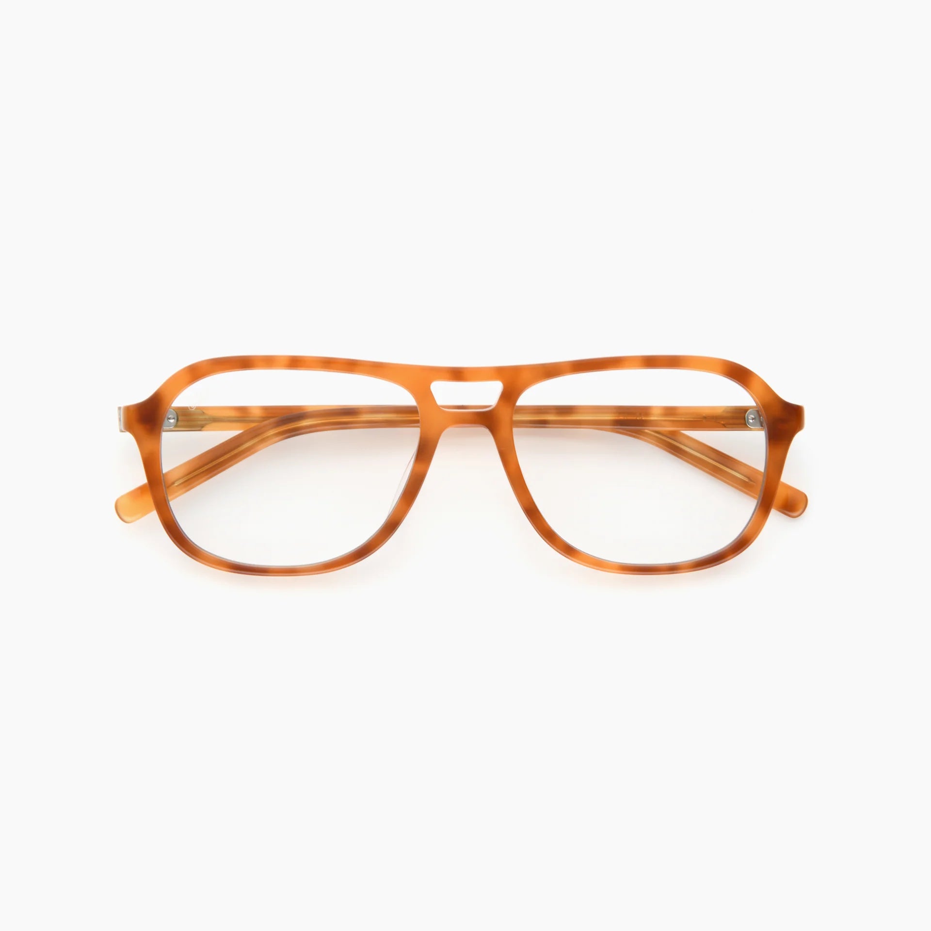 The Akila Myca by Akila is a pair of amber tortoiseshell aviator eyeglasses with clear, blue-light-filtering lenses, featuring a double bridge and wide temples, displayed on a white background.