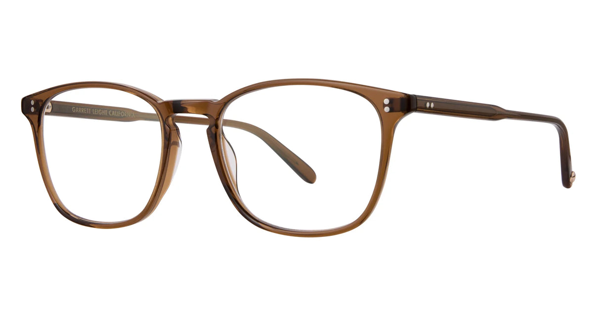The Garrett Leight Boon 52 eyeglasses by Garrett Leight feature clear brown rectangular frames crafted from durable acetate, with slightly rounded edges, thin arms, and metallic hinges. These keyhole bridge glasses are displayed against a crisp white background.