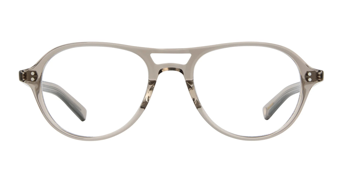 The Garrett Leight Hancock eyeglass frames by Garrett Leight are handcrafted in a refined aviator style, featuring beige acetate and clear lenses. Photographed against a white background, the image highlights the front view and temple arms extending back—showcasing timeless eyewear inspired by classic aviator sunglasses design.