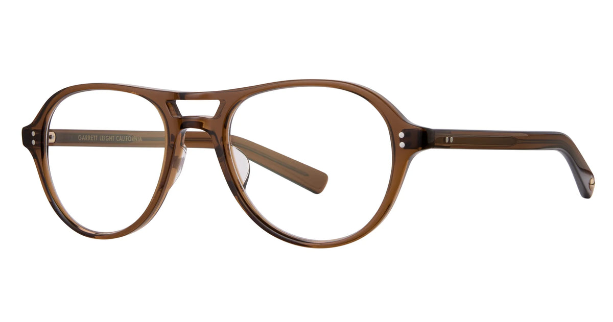 Garrett Leight Hancock eyeglasses by Garrett Leight feature brown transparent frames with round lenses and a keyhole bridge, beautifully displayed from the front on a white background—an elegant example of handcrafted eyewear.