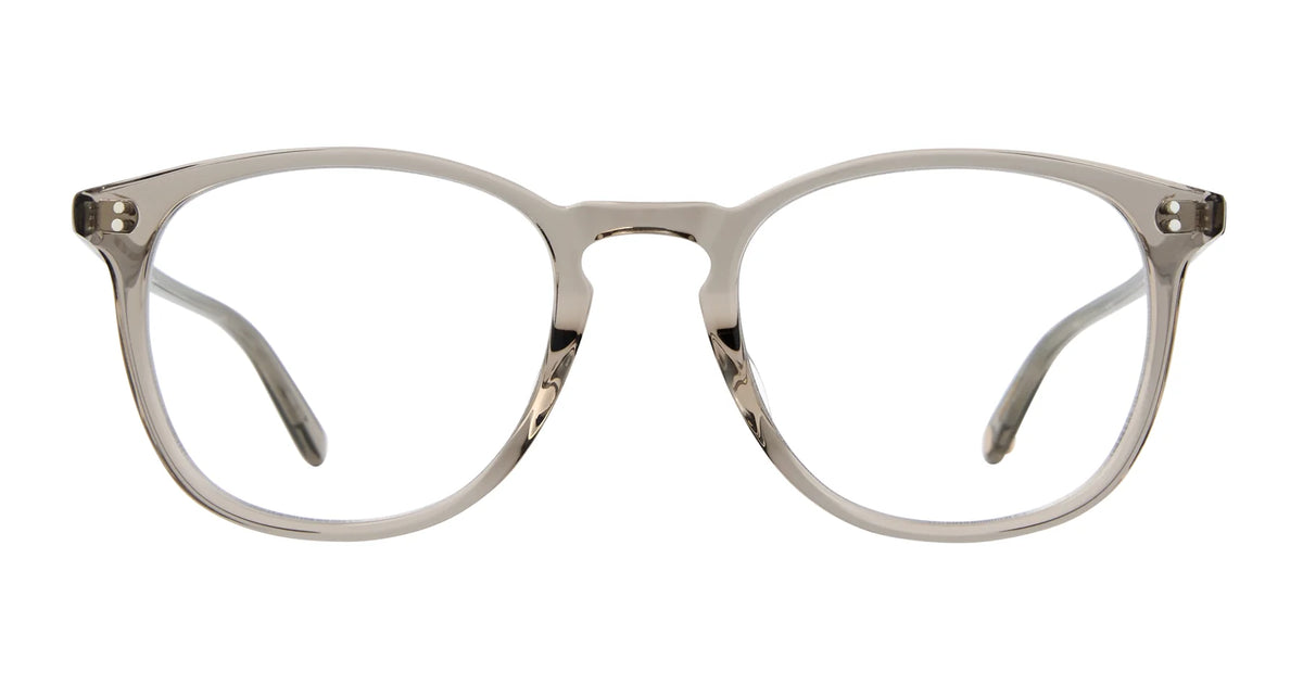 Garrett Leight Kinney 47 eyeglasses by Garrett Leight, featuring clear plastic frames with optical quality lenses and a subtle semi-square shape, shown from the front on a white background.