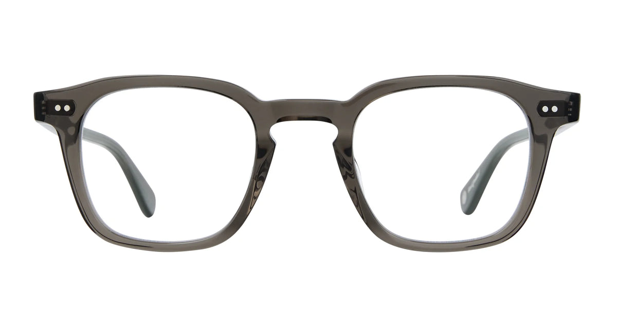 Garrett Leight Verdugo eyeglass frames by Garrett Leight, shown in gray with clear lenses, are rectangular with a slight gloss and rounded edges. Viewed from the front against a white background, they feature two small dots on each end piece for added detail—a look reminiscent of classic GLCO sunglasses.