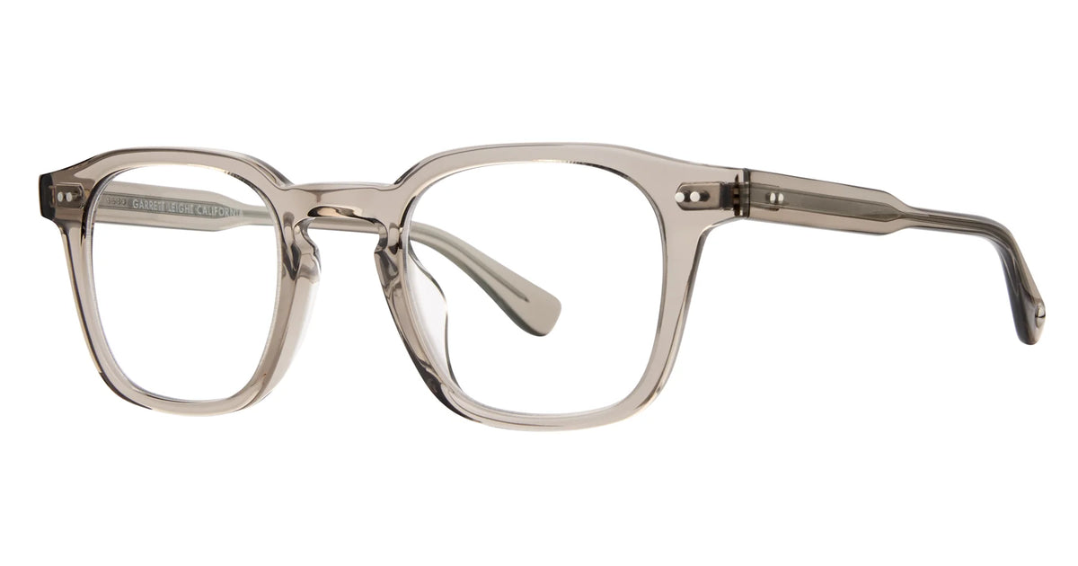 Translucent rectangular eyeglass frames with gently rounded edges, a keyhole bridge, and sturdy transparent arms—these Garrett Leight Verdugo sunglasses combine modern style with 100% UV protection for eye safety.