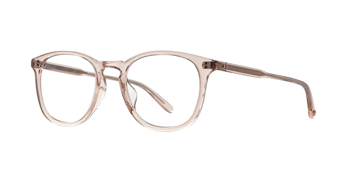 Garrett Leight Kinney 49 by Garrett Leight: classic, round optical glasses crafted from transparent light pink cellulose acetate, featuring slightly curved arms and a timeless silhouette, shown on a white background.