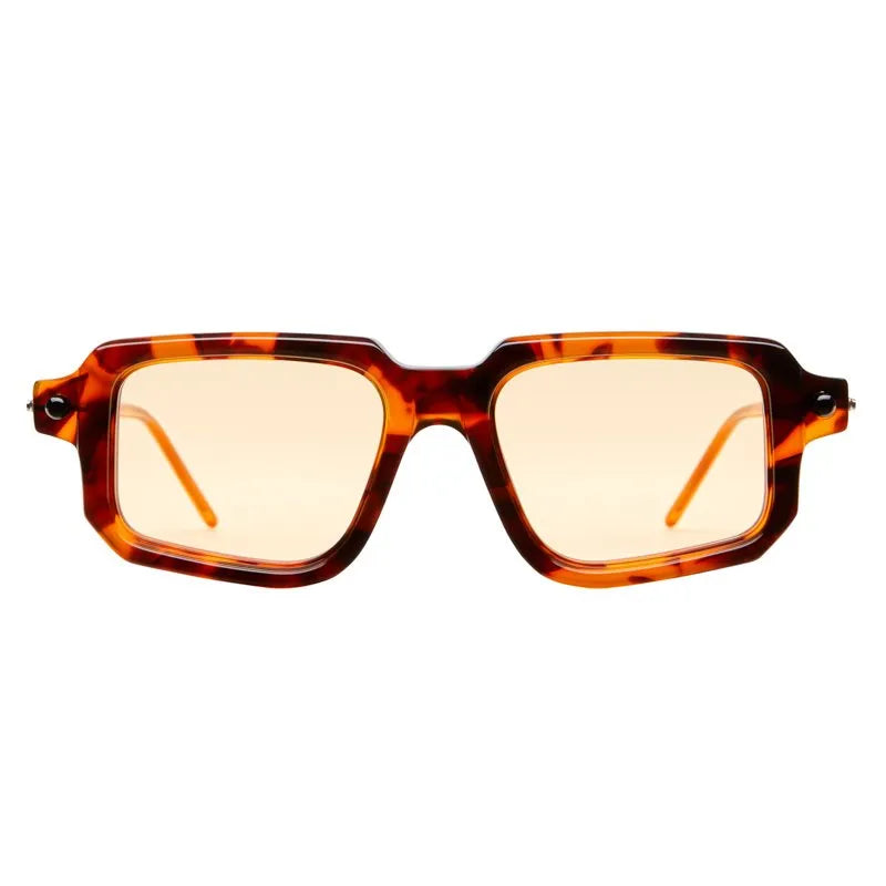 Tortoiseshell sunglasses with amber lenses on a white background