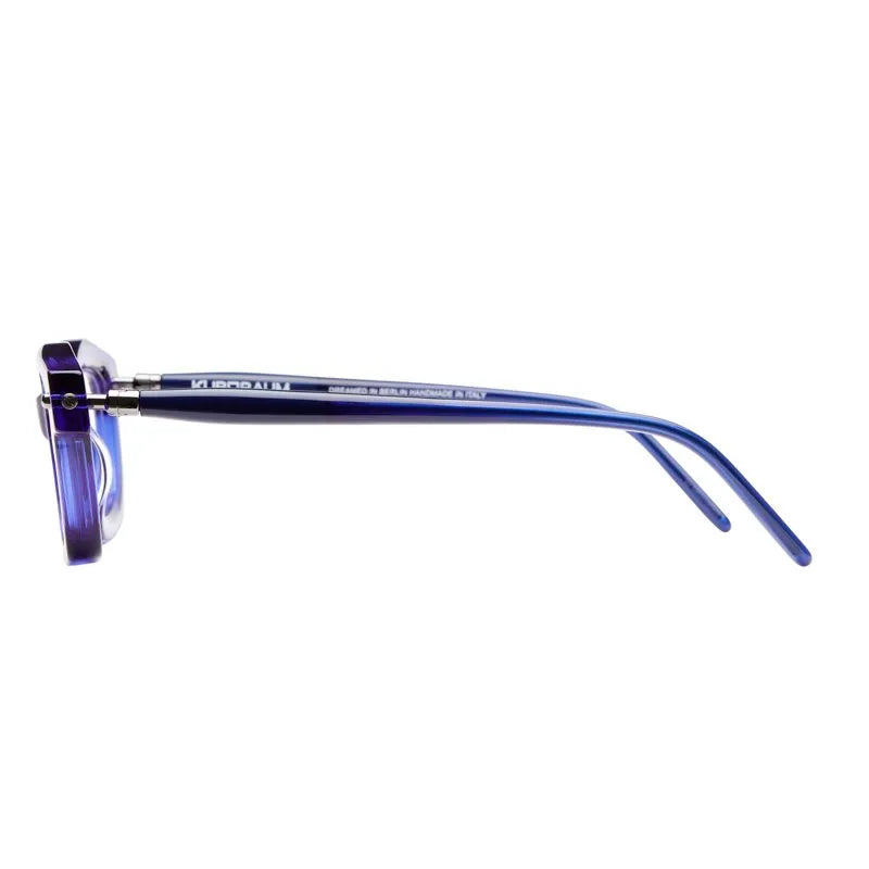 Side view of the Kuboraum P25 eyeglasses by Kuboraum, featuring blue translucent frames and slightly curved temples, shown against a white background—an exquisite piece of designer eyewear, handmade in Italy.
