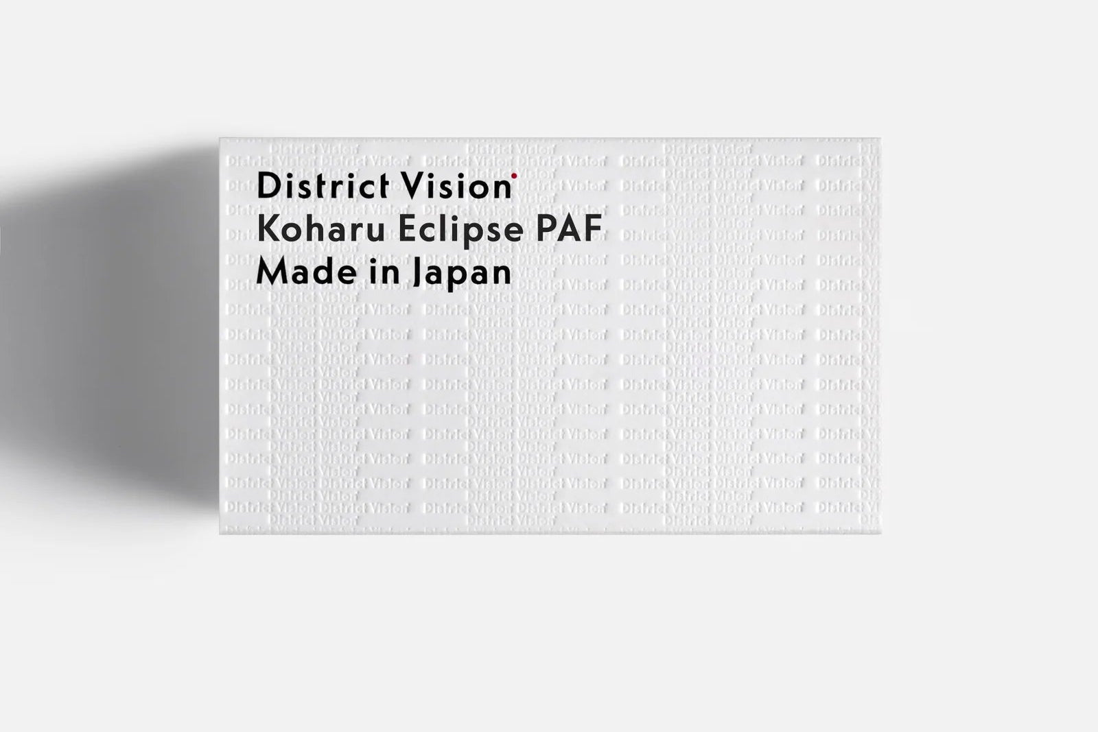 White textured product packaging with black text on a white background