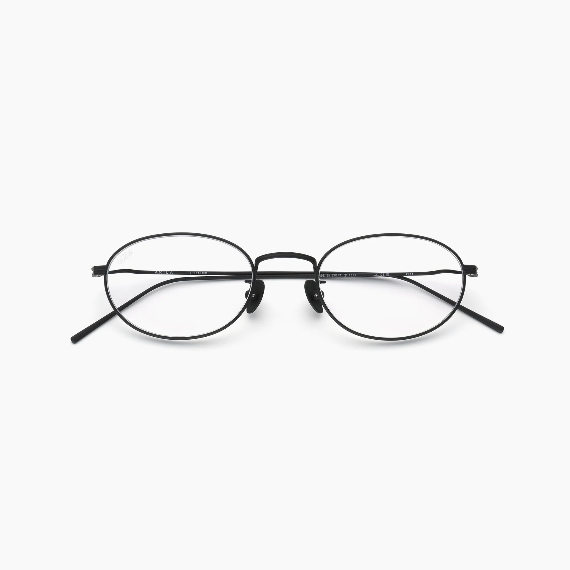 Black oval optical glasses with thin metal rims, clear lenses, adjustable nose pads, and slim temples, shown front-facing on a white background.