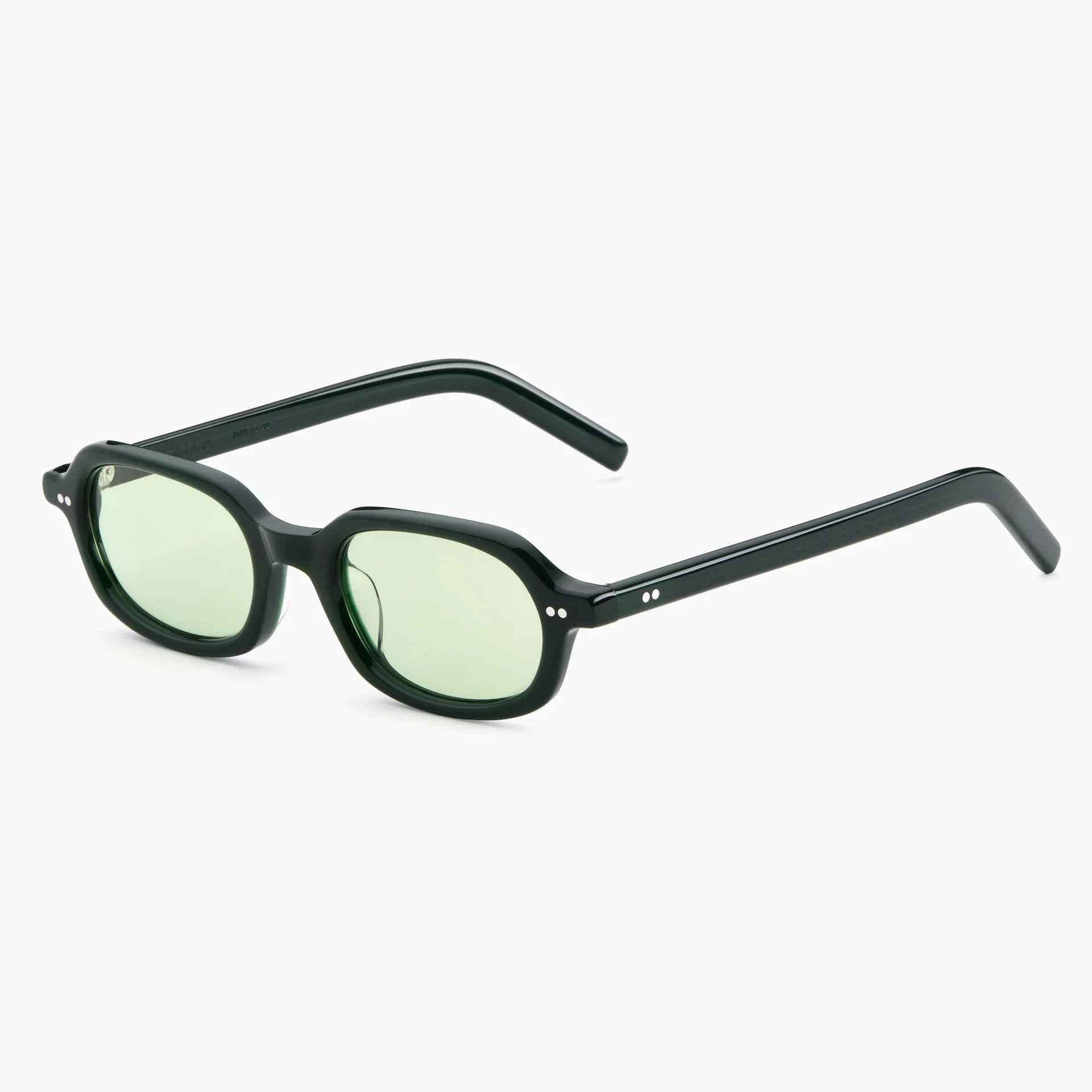 Black-framed sunglasses with green lenses on a white background
