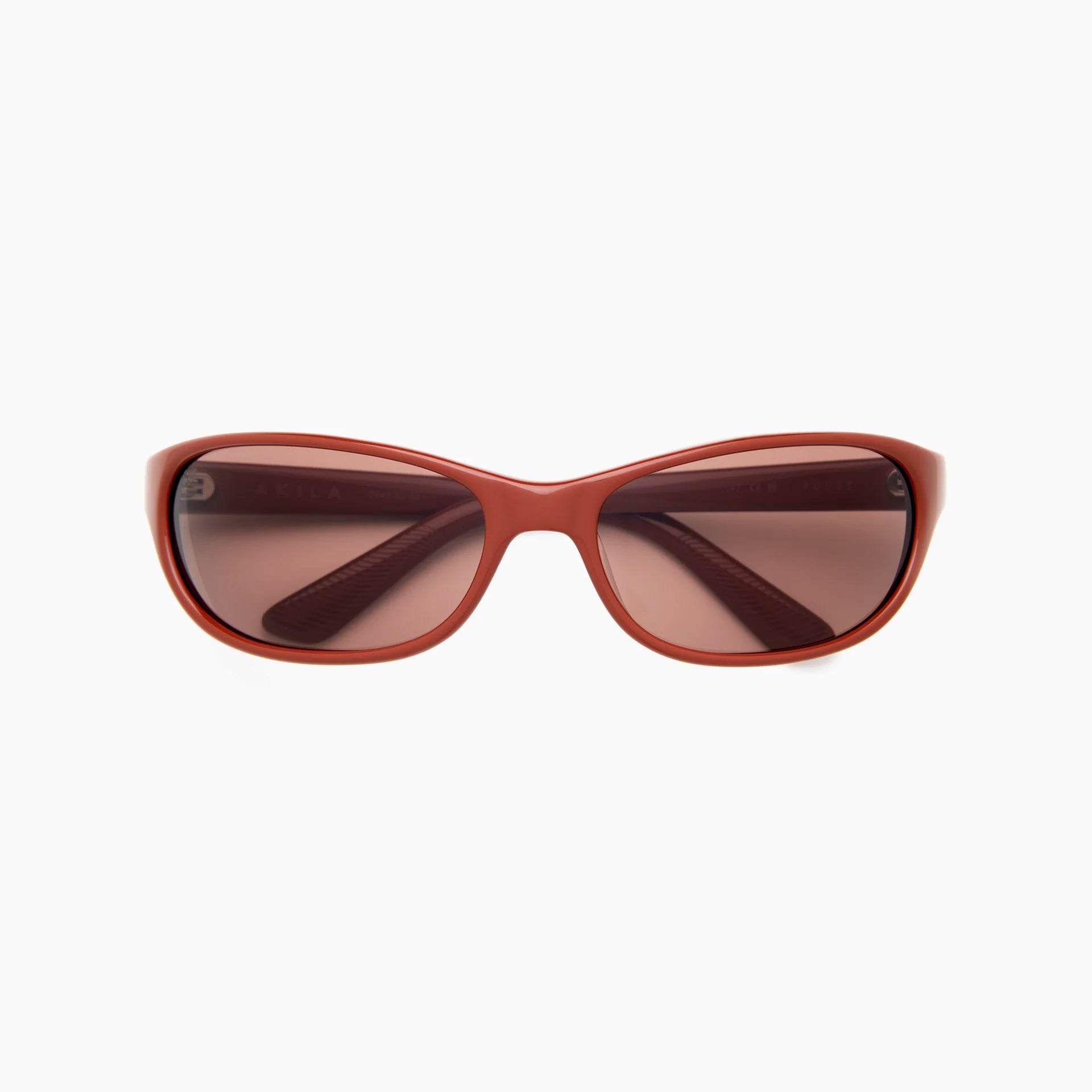 Red-brown wrap-style sunglasses with brown-tinted lenses and a slim molded frame, shown front-facing on a white background.