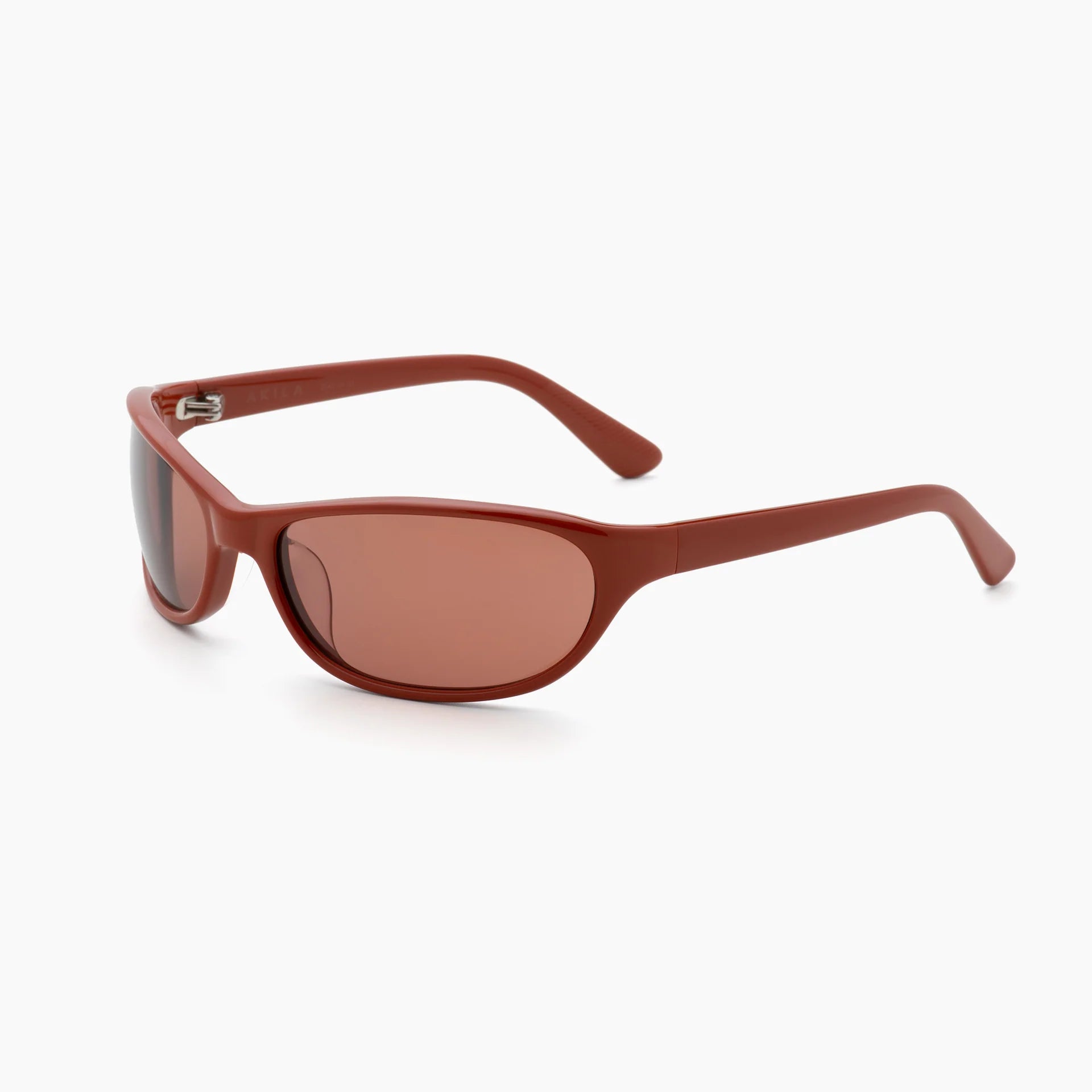 Red-brown wrap-style sunglasses with matching brown-tinted lenses, thick curved temples, and a molded frame, shown at an angled side view on a white background.