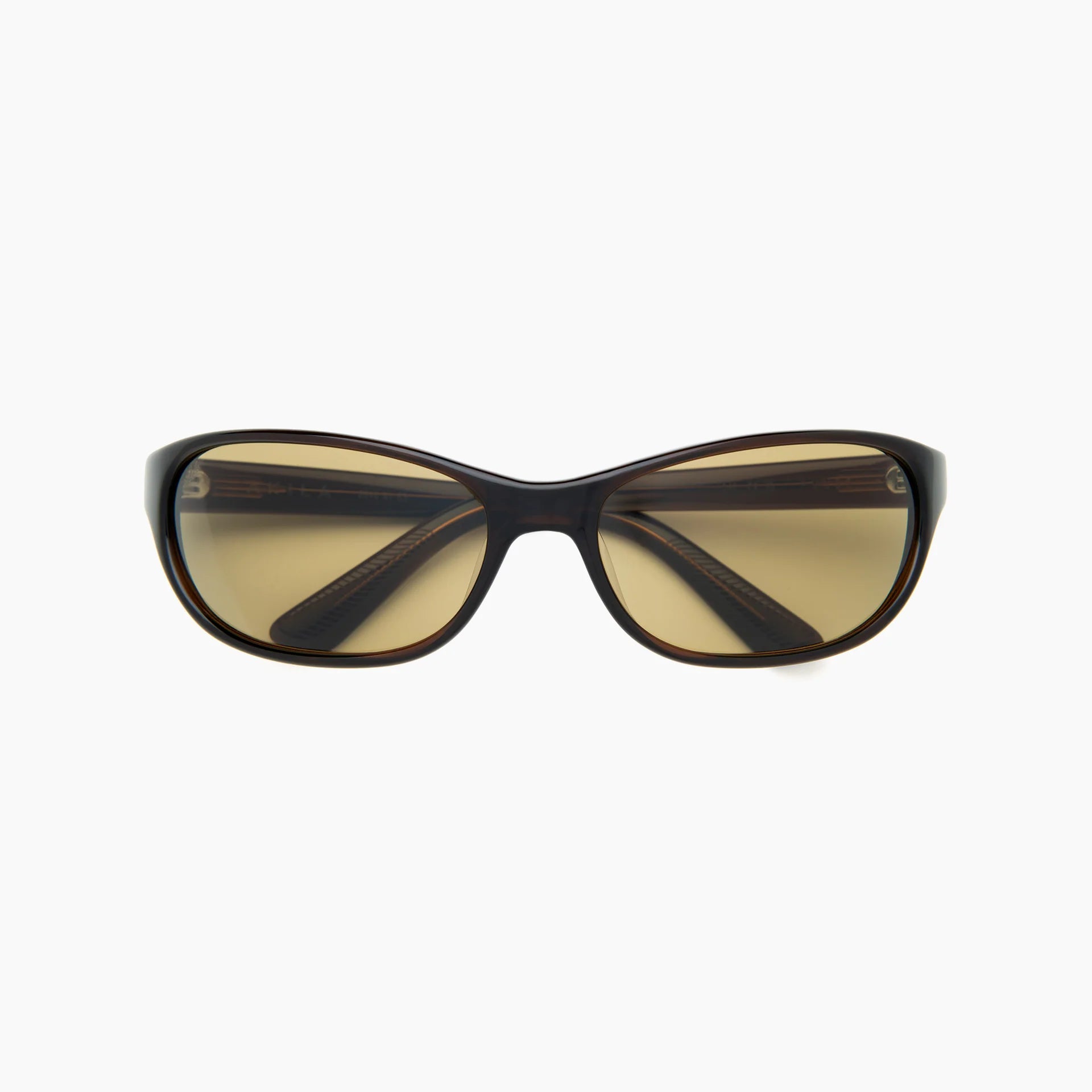 Dark tortoise wrap-style sunglasses with yellow-tinted lenses and a slim molded frame, shown front-facing on a white background.