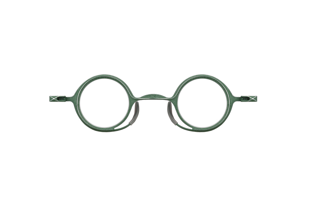 RIGARDS round optical glasses in textured green metal with an arched bridge and geometric temple accents, shown from the front.