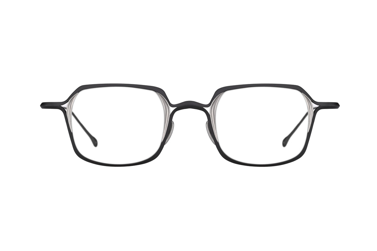 The RIGARDS RG2004TVA by RIGARDS are black rectangular eyeglasses featuring thin titanium frames and clear lenses, shown from the front against a white background.