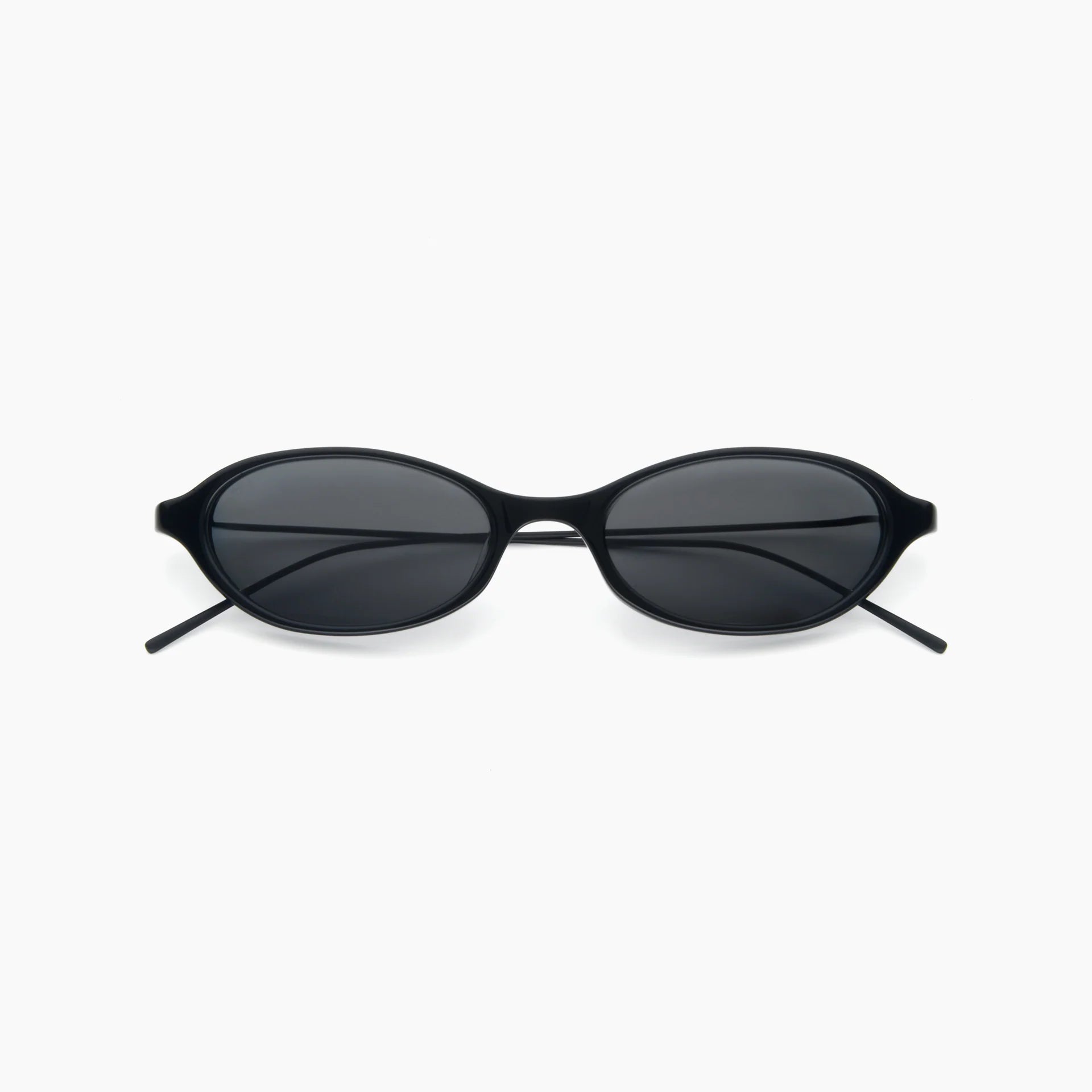 Black oval sunglasses with dark tinted lenses and a slim black frame, shown front-facing on a white background.