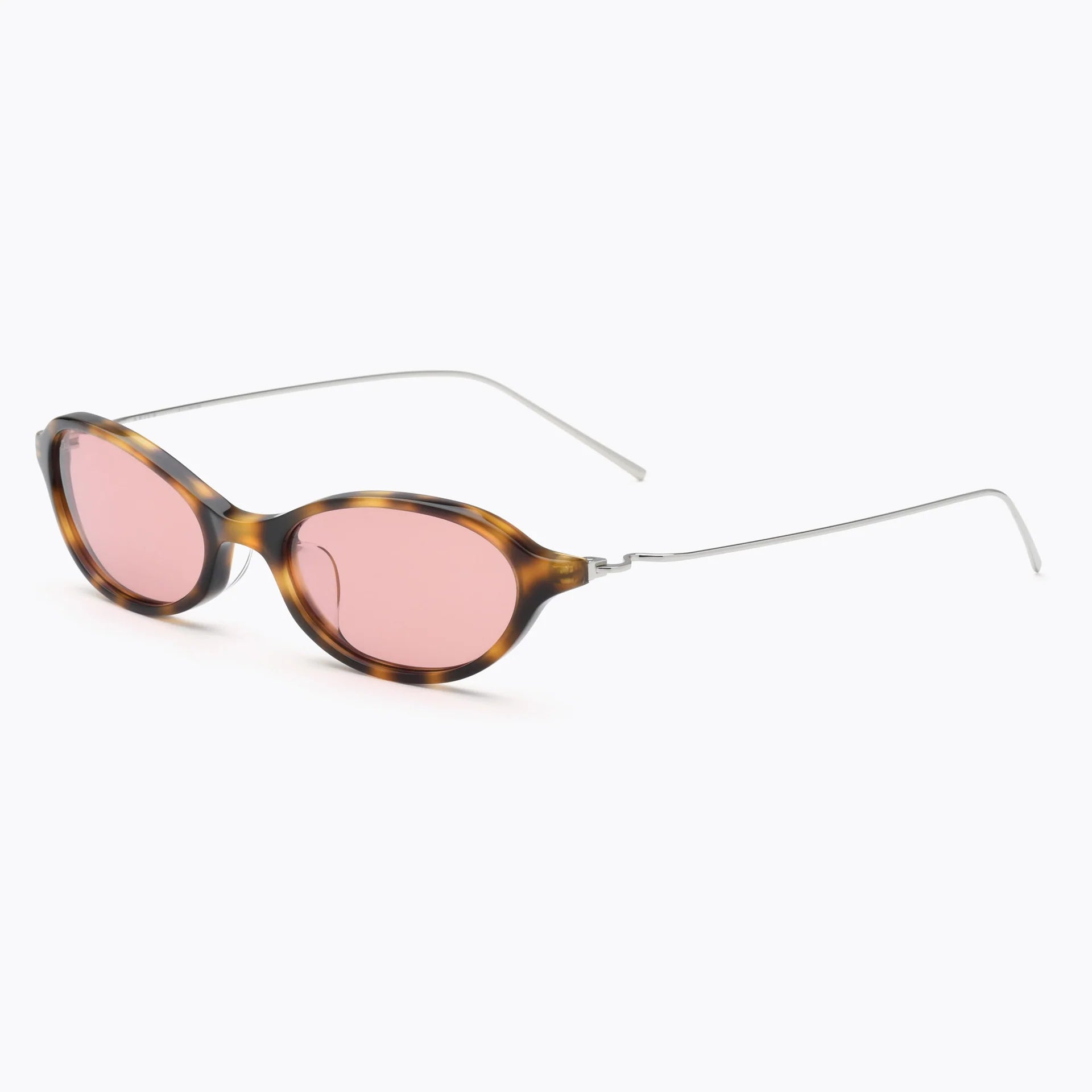 Tortoise oval sunglasses with rose-tinted lenses and thin silver metal temples, shown at an angled side view on a white background.