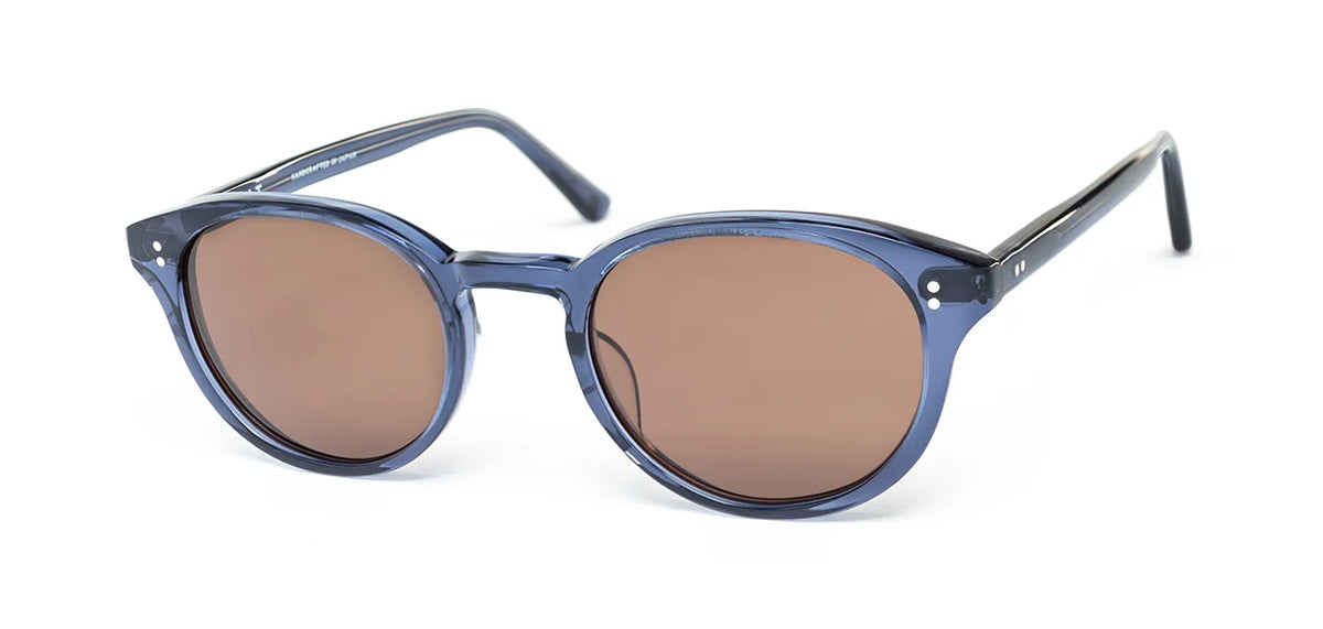 The SALT. Spencer sunglasses by SALT. showcase a stylish round optical frame crafted from premium Japanese acetate, featuring blue frames with brown-tinted lenses and displayed on a white background.