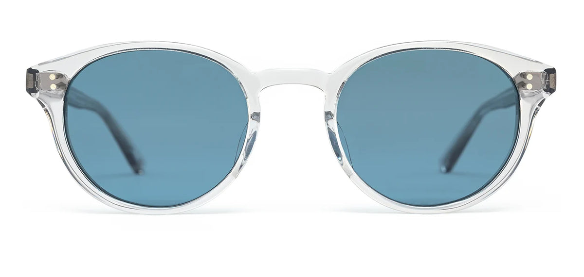 The SALT. Spencer sunglasses by SALT. feature clear-framed, round Japanese acetate optical frames with blue-tinted lenses, shown from the front on a white background, combining lasting durability and style.