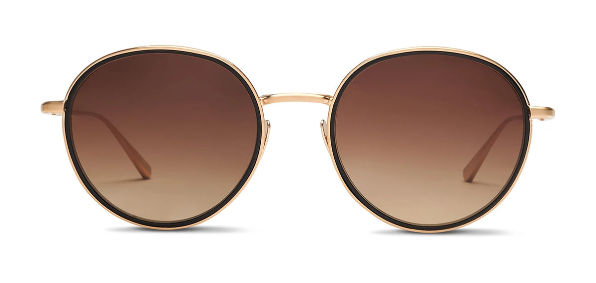 The SALT. Seine oversized round sunglasses by SALT., featuring gold metal frames and brown gradient lenses, are shown from the front on a white background.