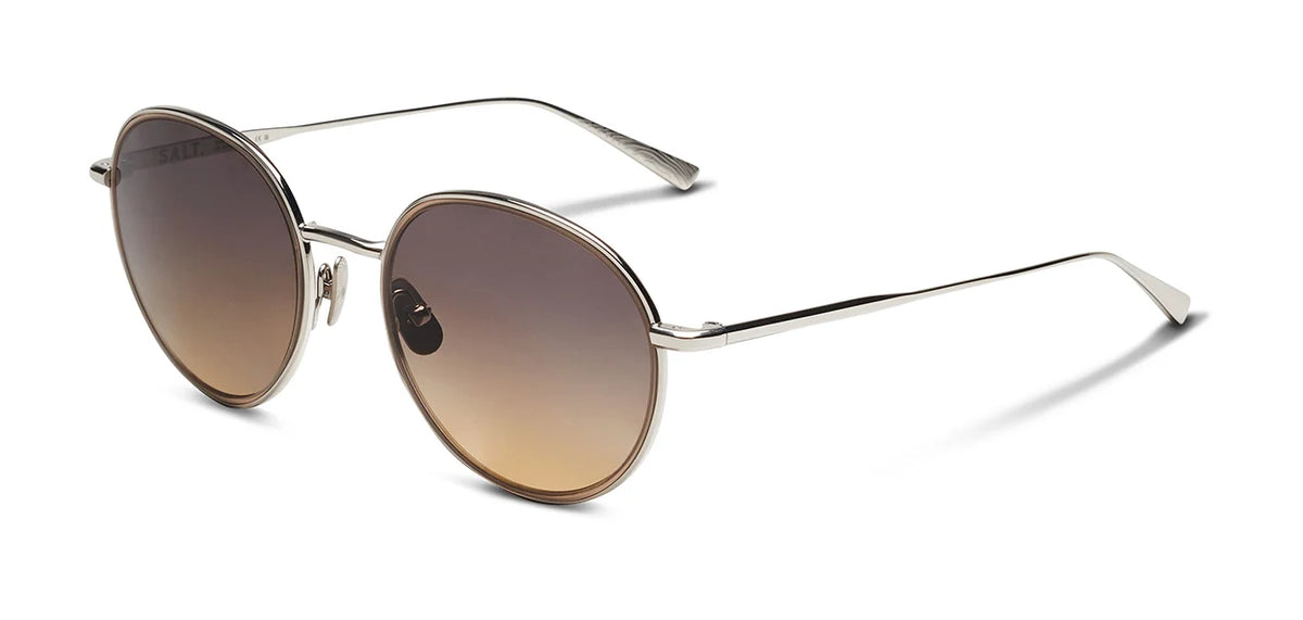 The SALT. Seine sunglasses by SALT. feature oversized round frames crafted from thin metal and gradient brown lenses, inspired by mid-century modern design, and are displayed on a white background.
