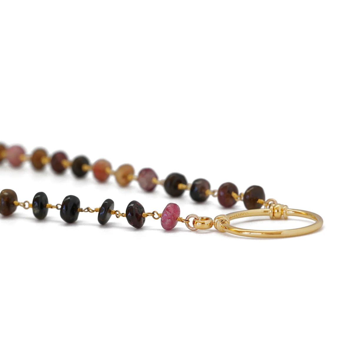 La Loop Stella glasses holder featuring a gold-plated ring on a necklace string of multi-colored, flat, circular beads.