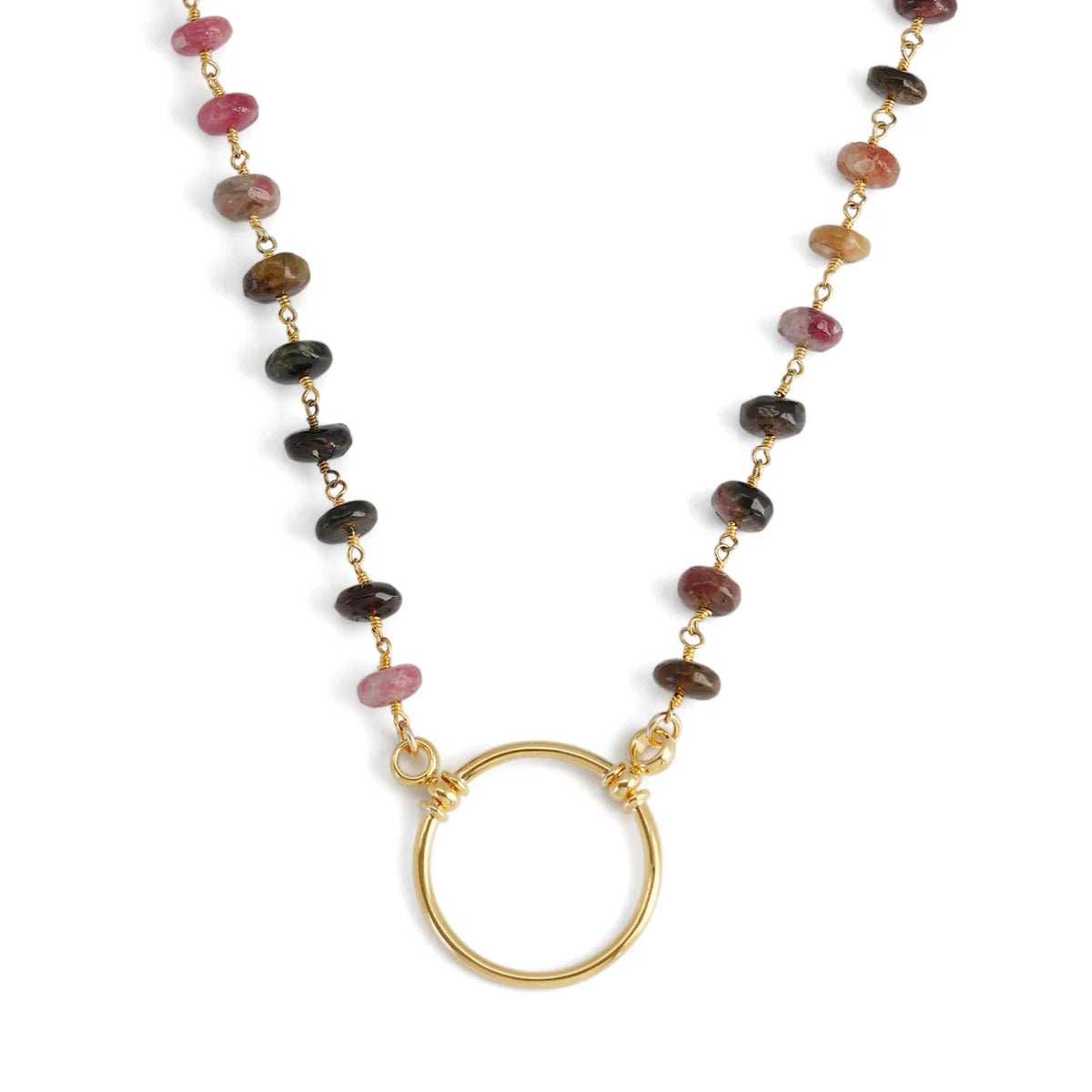 The La Loop Stella necklace features black spinel beads on a gold-plated chain with a circular pendant at the center, doubling as a glasses holder.