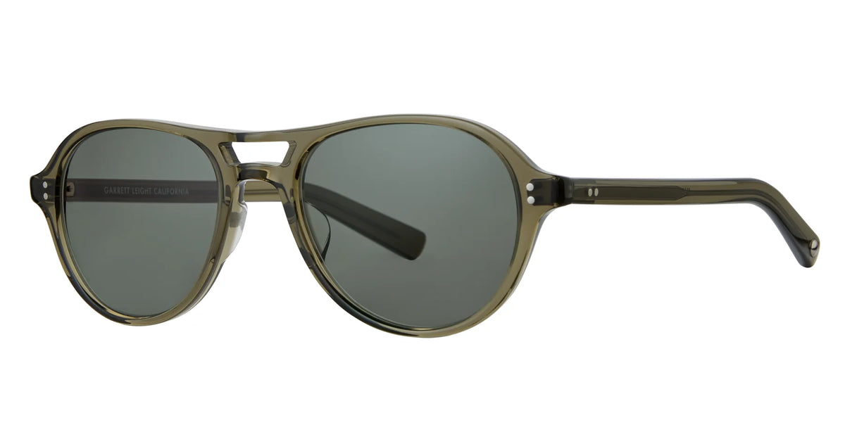 The Garrett Leight Hancock sunglasses by Garrett Leight feature olive green, thick plastic frames with round lenses and a keyhole bridge. The dark lenses provide reliable UV protection, while the straight arms curve slightly at the ends for comfort.