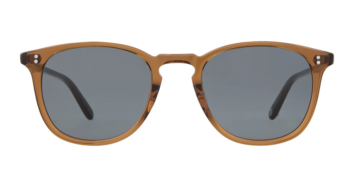 Garrett Leight Kinney 49 sunglasses in brown, featuring round premium glass lenses and thin frames, are displayed facing forward on a white background. These stylish Garrett Leight sunglasses provide 100% UV protection with their dark tinted lenses.