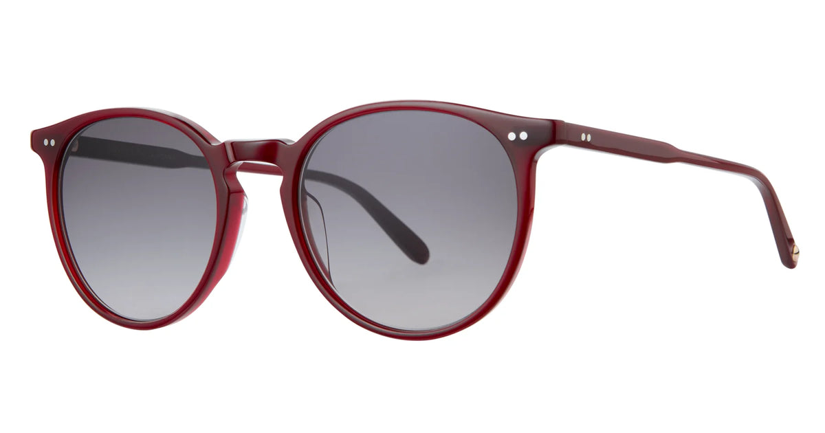 The Garrett Leight Morningside sunglasses feature oversized round dark lenses and bold red acetate frames, shown from an angle on a white background. These statement acetate sunglasses by Garrett Leight offer dependable UV protection and infuse any look with vintage-inspired flair.