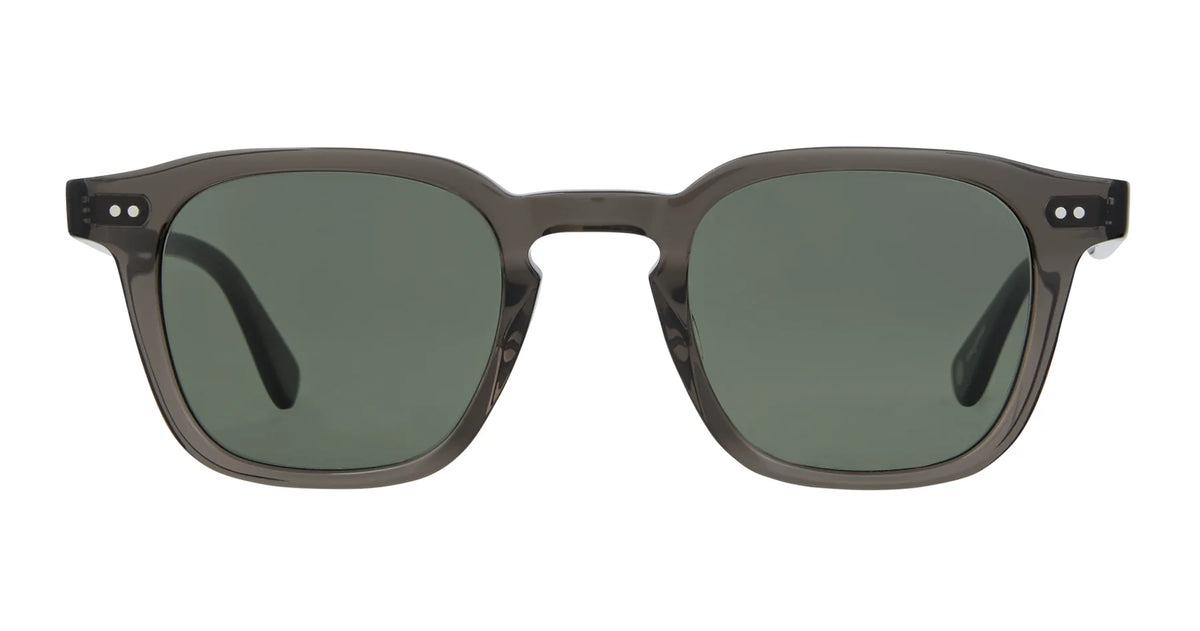 Garrett Leight Verdugo rectangular sunglasses with dark green lenses and a transparent gray frame, offering reliable UV protection by Garrett Leight. Shown from the front against a white background.