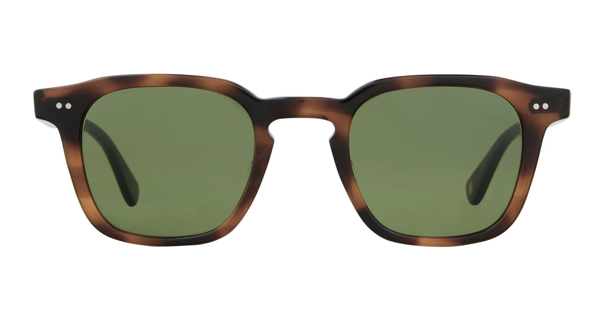 Introducing the Garrett Leight Verdugo sunglasses by Garrett Leight. These premium shades feature a rectangular tortoiseshell frame with two small silver dots on each side of the front, complemented by green lenses that provide reliable UV protection. Handmade in Japan, the Verdugo offers exceptional quality and timeless style for your eyes.