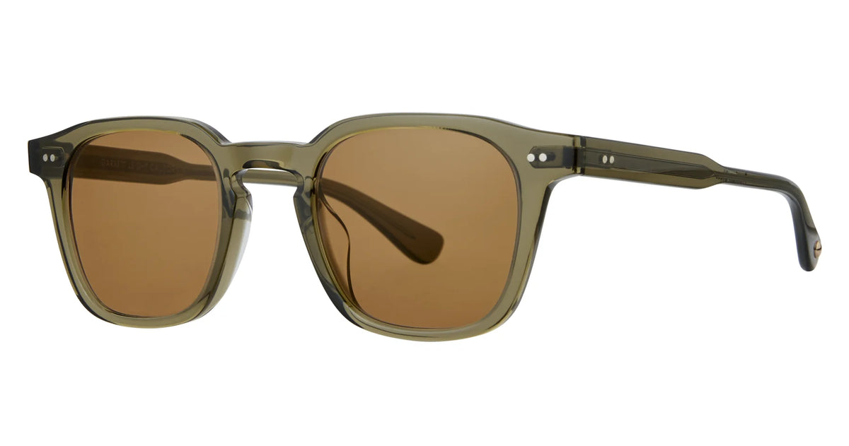 Introducing the Garrett Leight Verdugo sunglasses by Garrett Leight—handmade in Japan, these premium transparent olive green frames feature thick plastic construction, rectangular brown lenses for reliable UV protection, and coordinated colored arms. Distinctive metal dots accent each hinge, combining style and craftsmanship for a standout look.