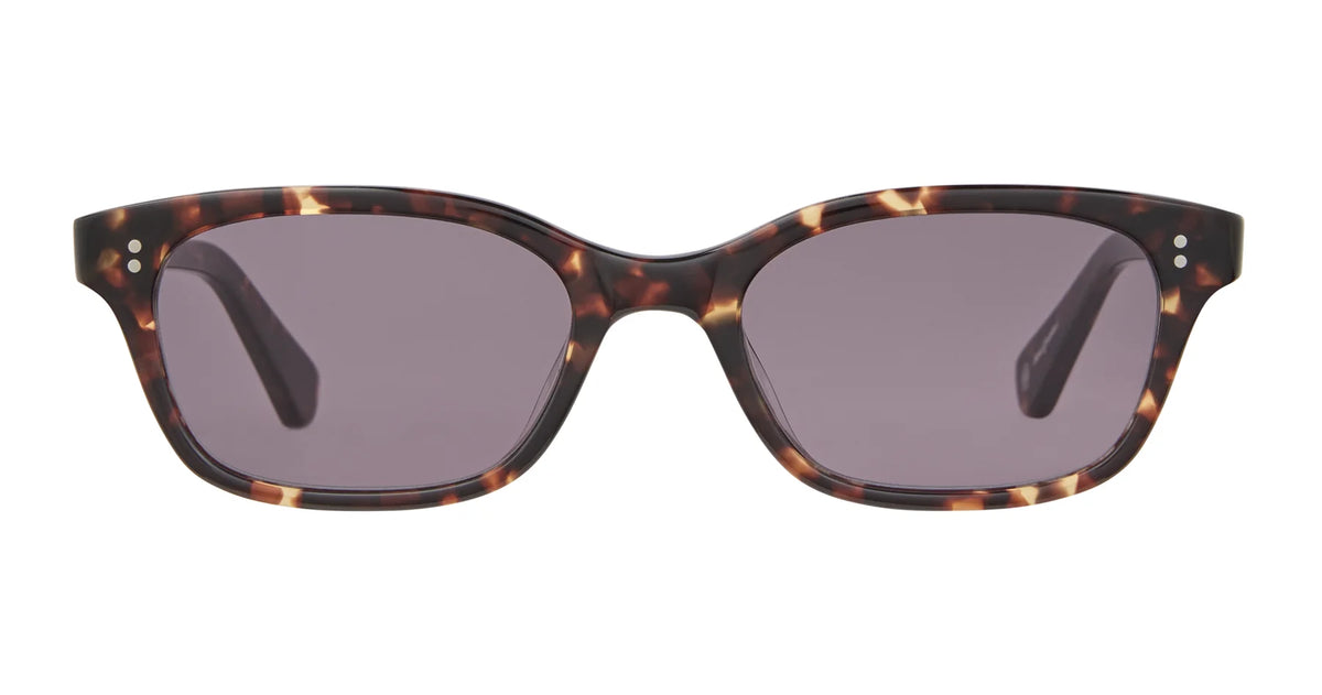 The Garrett Leight Chaparral by Garrett Leight is a pair of rectangular tortoiseshell sunglasses with dark lenses, providing 100% UV protection, shown from the front against a white background.