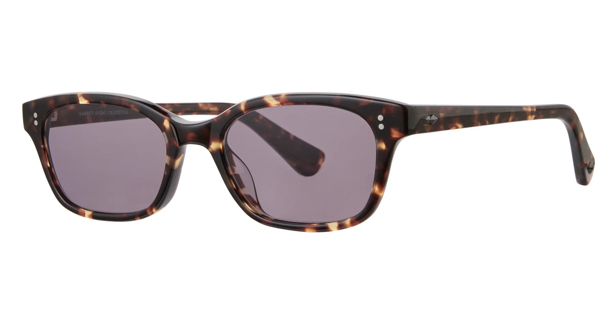 Garrett Leight Chaparral rectangular sunglasses in a tortoiseshell finish with dark lenses, offering 100% UV protection, are displayed at a slight angle on a white background.