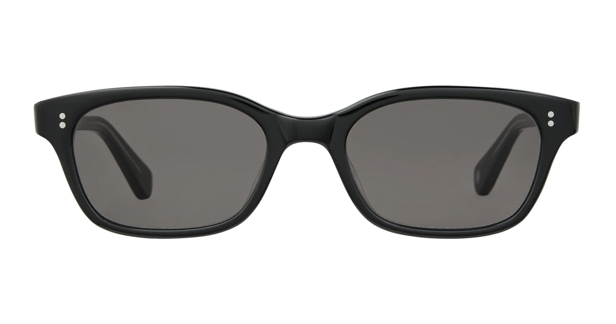 The Garrett Leight Chaparral sunglasses by Garrett Leight feature a black rectangular frame with dark lenses, seen from the front against a white background. The thick frame is accented by small silver details at the corners near the hinges and provides 100% UV protection. Expertly crafted in Japan, these sunglasses combine high-quality workmanship with timeless style.