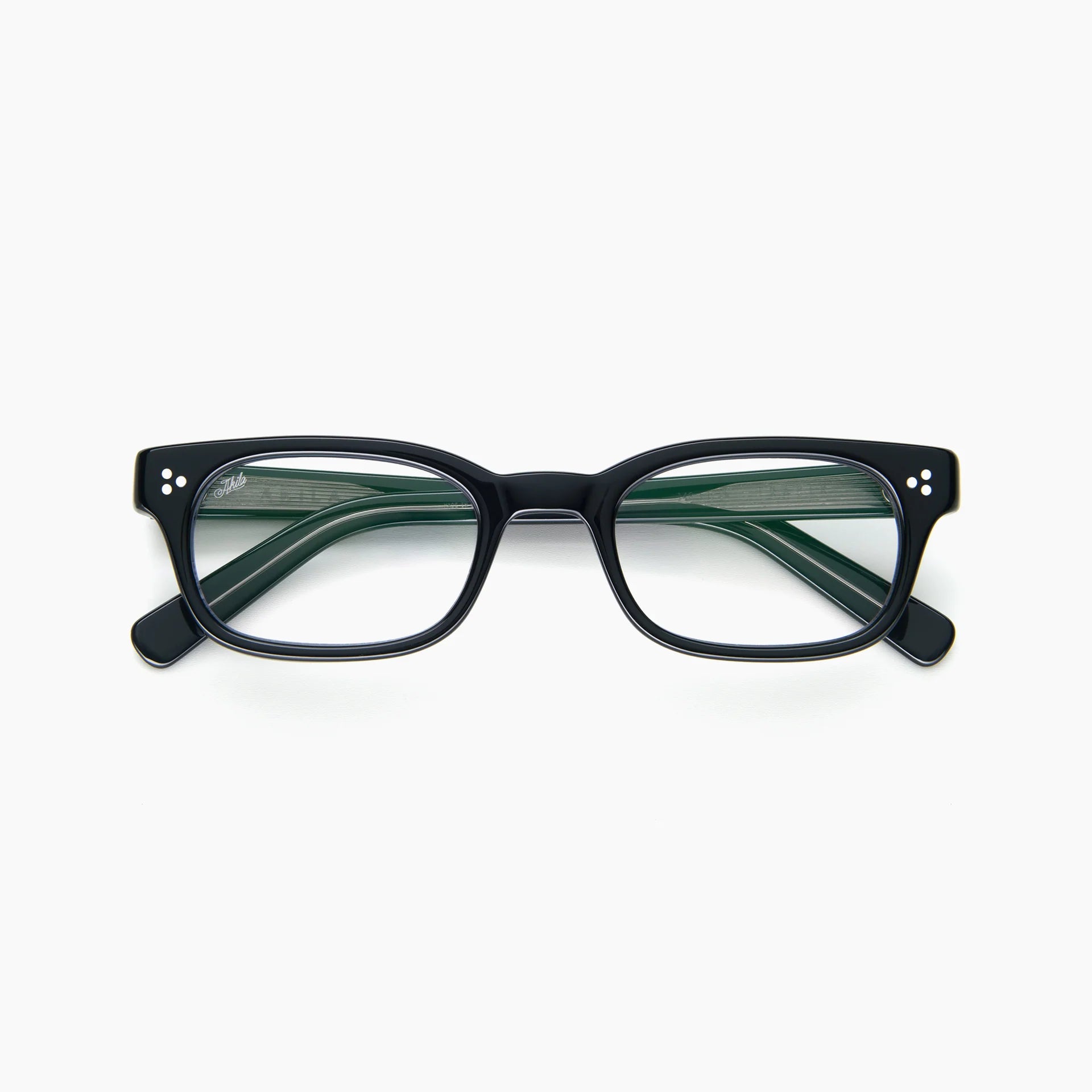 Akila Tracer eyeglasses by Akila, featuring a black thick rectangular frame and clear lenses with signature blue light blocking technology, shown from the front on a white background.