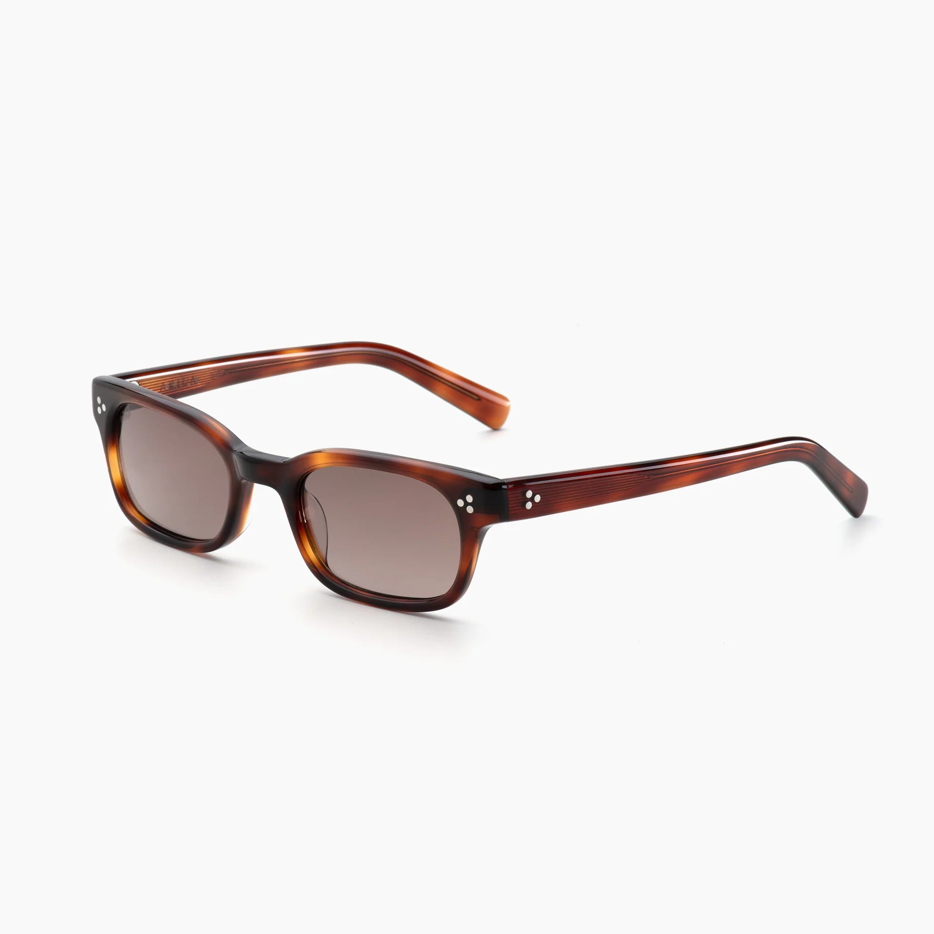 Brown tortoise rectangular acetate sunglasses with brown-tinted lenses, white rivet accents, and thick temples, shown at an angled side view on a white background.