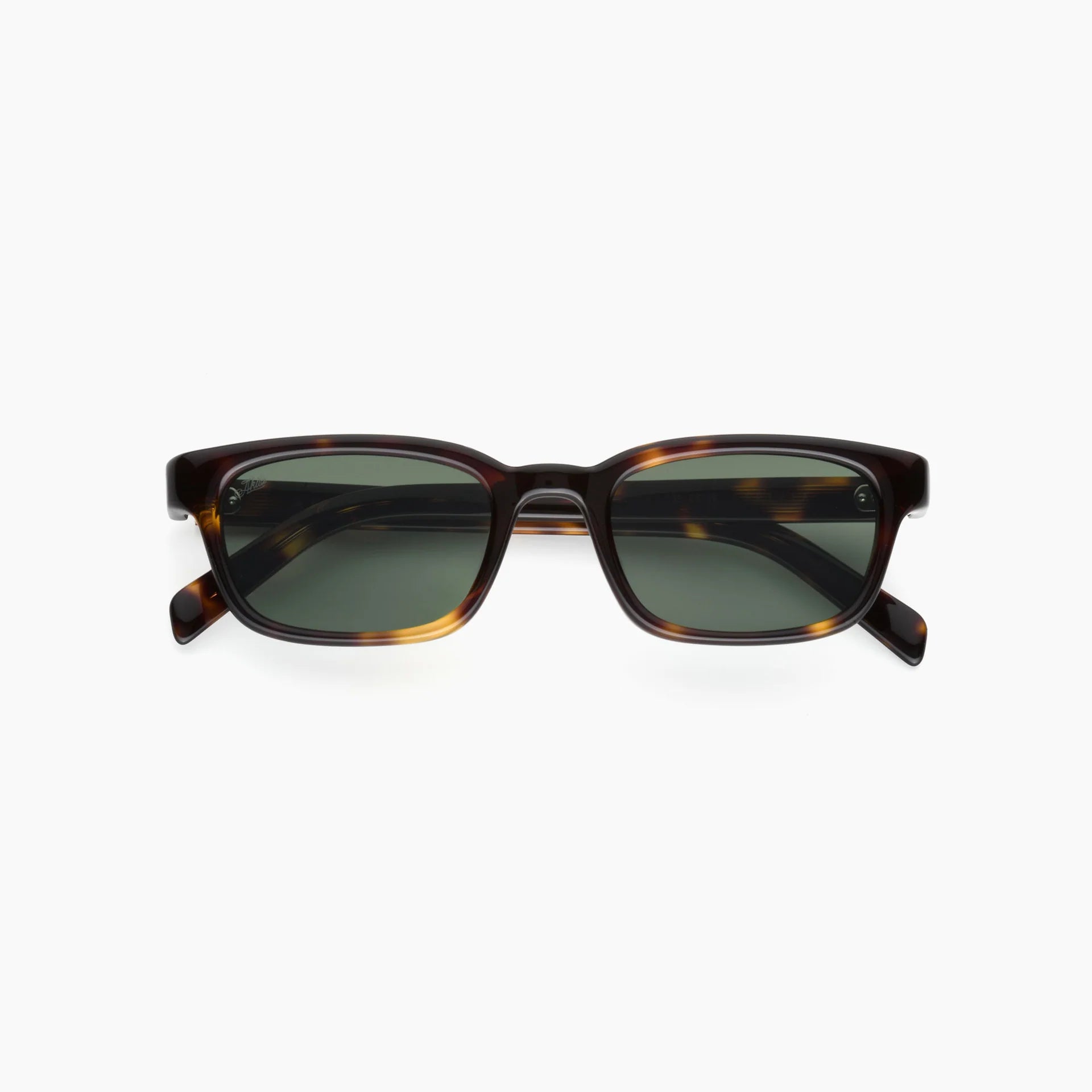 Sunglasses with tortoiseshell frame and dark lenses on a white background