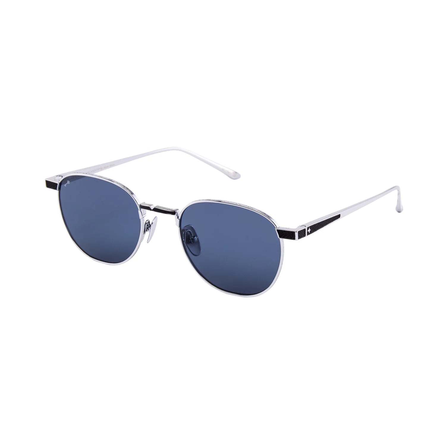 Leisure Society Verlaine sunglasses by Leisure Society, featuring a silver frame, round P3-inspired design, thin metal arms, and dark blue polarized Trivex sun lenses, shown on a white background.