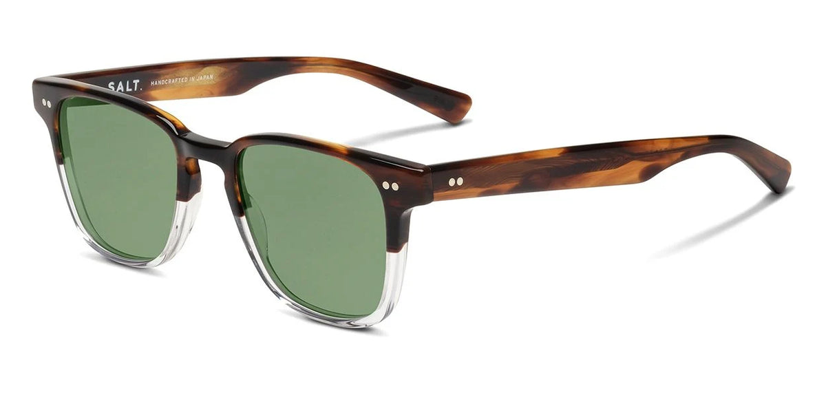 SALT. Reiner sunglasses by SALT. feature Japanese tortoiseshell acetate frames with green polarized glass lenses, clear accents along the bottom of the frames, and two small metal dots on each side near the hinges. The lenses are finished with an anti-reflective coating to provide enhanced clarity and comfort.
