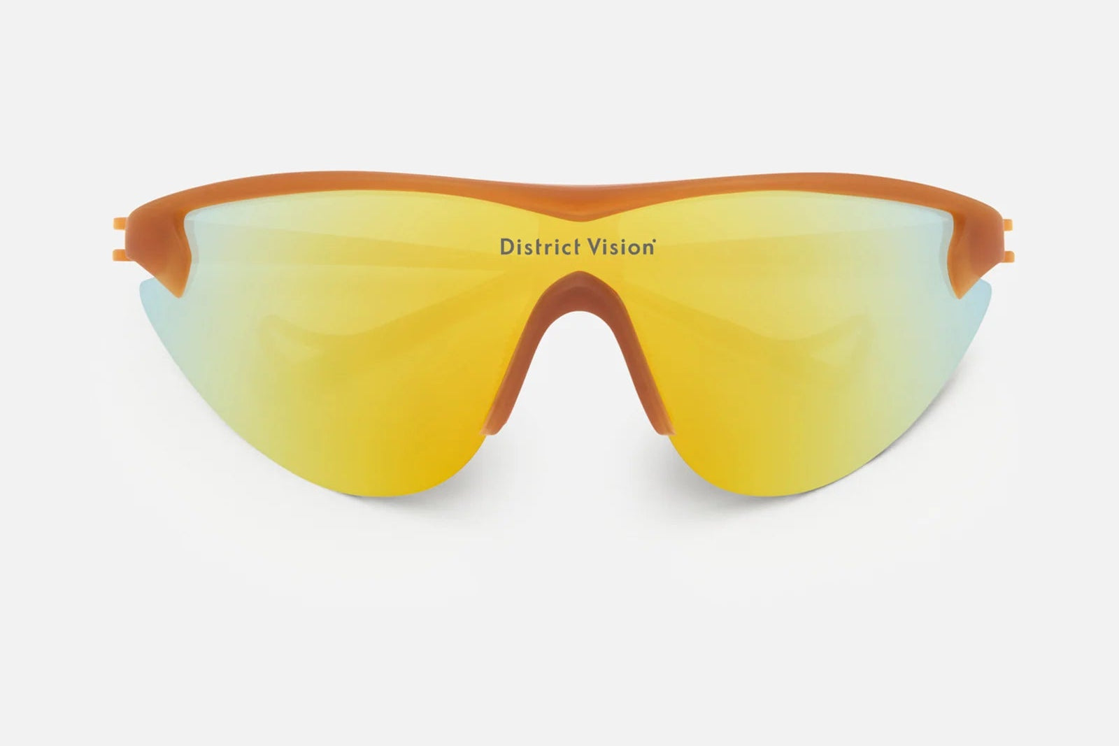 A pair of District Vision Yukinori Range Finder cycling sunglasses, featuring a sleek wraparound design with yellow mirrored lenses, an orange frame, and “District Vision” printed on the lens, displayed on a white background.