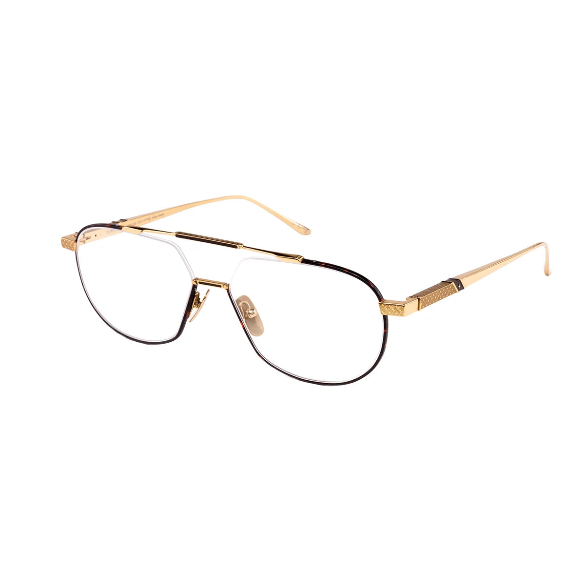 The Leisure Society Yuma by Leisure Society is a luxurious titanium optical frame featuring gold-rimmed aviator-style eyeglasses with clear lenses, thin arms, and brown accents on the upper part of the frames, elegantly displayed on a white background.
