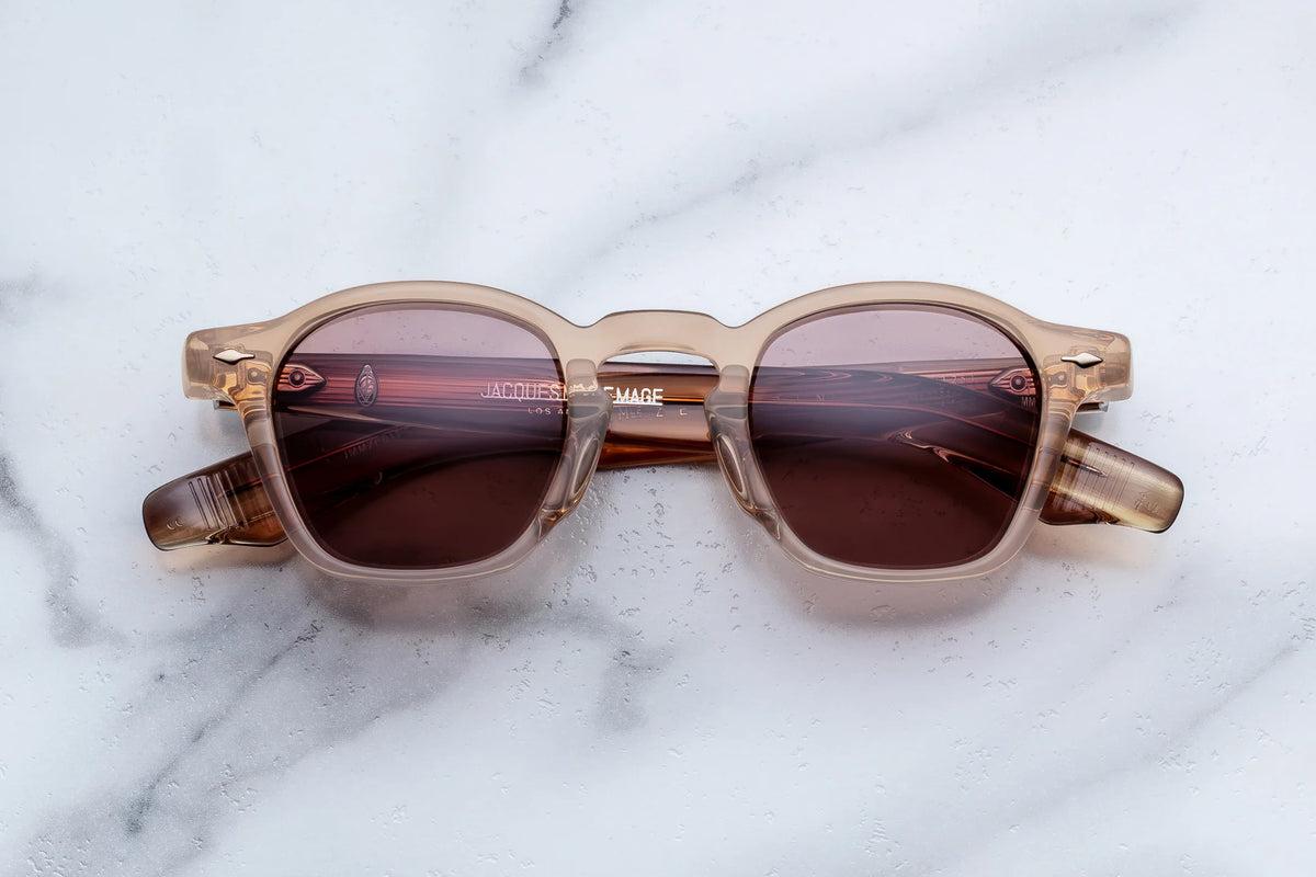 Jacques Marie Mage Zephirin translucent beige rectangular sunglasses with brown tinted lenses and sculpted temple construction.